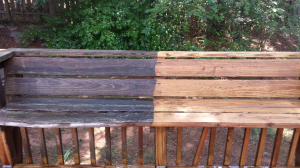 wood bench half pressure washed so you can see difference